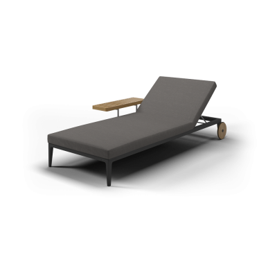 Outdoor sun lounger with side table